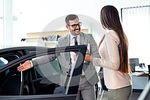 Sales manager at a showroom car is worth to the buyer