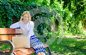 Sales manager works in park. Woman with laptop works outdoors. Best sales managers always possess these skills. Call photo