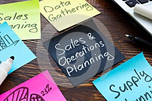 Sales and operations planning concept. Memo sticks on desk.