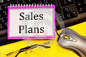 Sales plan-writing on a Notepad. Long-term vision of future actions, development of a method for achieving the goal of stable long