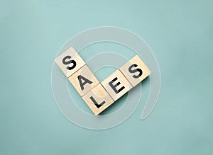 SALES symbol. Concept word Basics on wooden blocks