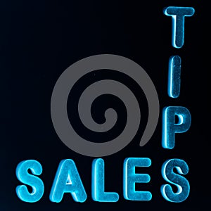 sales tips text written on dark abstract background