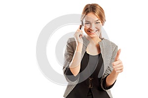 Sales woman talking on the phone and showing thumbs-up