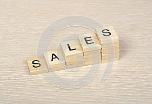 SALES word written on wooden cubes. Finance Concept. Money