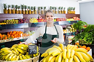 Salesgirl proposing bananas