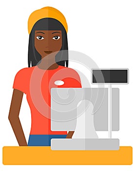 Saleslady standing at checkout