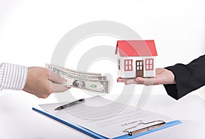 Salesman agent exchange house and money with customer photo