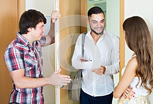 Salesman came home to couple