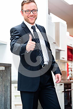 Salesman for domestic kitchen furniture store