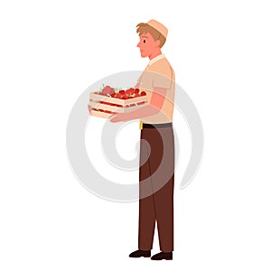 Salesman holding wooden box with vegetables, supermarket or grocery store worker selling