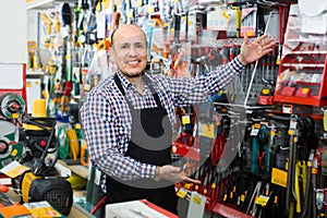 Salesman showing different tools