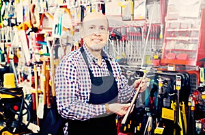 Salesman showing different tools