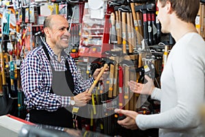 Salesman showing different tools