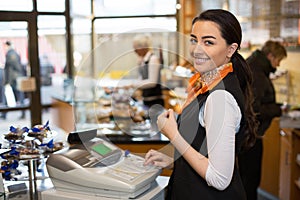 Salesperson at cash register photo