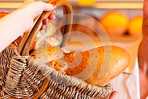 Salesperson with female customer in bakery