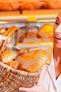 Salesperson with female customer in bakery