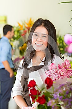 Saleswoman and customer in flower shop photo