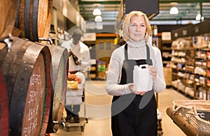 Saleswoman offering wine on tap