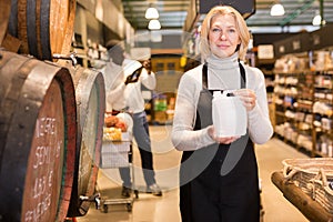 Saleswoman offering wine on tap