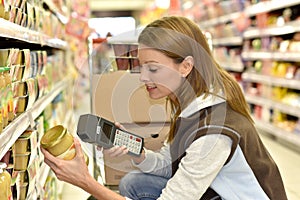 Saleswoman scanning products