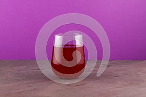 Salgam or fermented beet juice in clear glass. Popular Turkish drink.  Traditional beverage made with water, purple carrot or