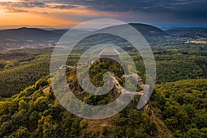 Salgotarjan, Hungary - Aerial view of Salgo Castle Salgo vara in Nograd county with dark storm clouds and golden sunset photo