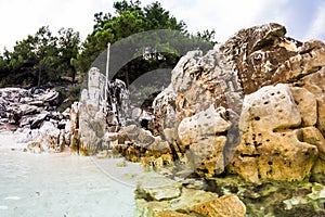 Saliara Beach called Marble Beach, beautiful white beach in Thassos island, Greece. Water and rocks