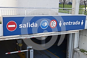 Salida, entrada sign at underground parking entrance. Exit, entry in spanish photo