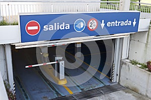 Salida, entrada sign at underground parking entrance. Exit, entry in spanish photo