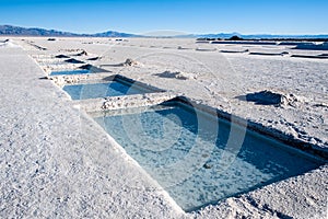 Salinas Grandes on Argentina Andes is a salt desert in the Jujuy Province. More significantly, Bolivas Salar de Uyuni is also photo