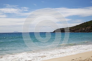 Saline beach at St. Barths, French West Indies with the view at the islands of St. Eustatius and Saba