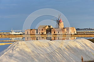 saline fields with windmill near town Marsala in Sicily,Italy