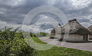 Salisbury plain - thatched houses and cloudy skies.