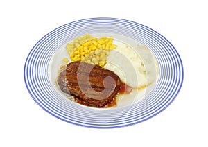 Salisbury steak dinner on blue plate