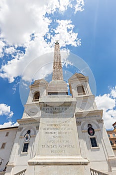 Sallustiano Obelisk and The church of the Santissima TrinitÃ  dei Monti against blue sky above Spanish Steps, Rome, Italy