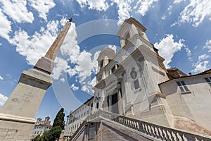 Sallustiano Obelisk and The church of the Santissima TrinitÃ  dei Monti against blue sky above Spanish Steps, Rome, Italy