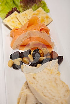 Salmon appetizer and bread, almonds photo