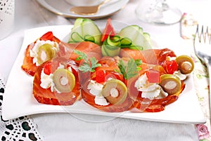 Salmon appetizer with cream cheese and olives