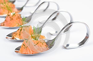 Salmon appetizers on spoons