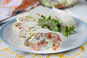 Salmon, avocado and cream cheese roll in lavash