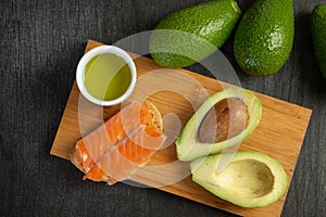 Salmon on bread slices gourmet appetizer with avocado. Fresh salmon   and avocado sandwich. Healthy food concept.