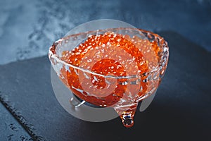 Salmon caviar in glass plate