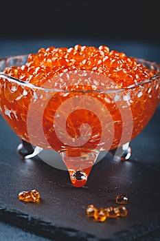 Salmon caviar in glass plate