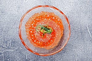 Salmon caviar in glass plate