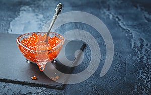 Salmon caviar in glass plate