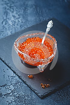 Salmon caviar in glass plate