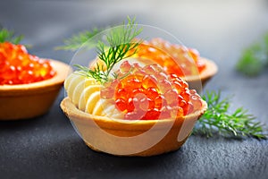 Salmon caviar. Tartlets with red caviar. Gourmet food. Seafood. Trout caviar