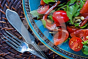 Salmon, cherry tomatoes, arugula salad, pine nuts, mozzarella