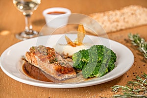 Salmon dish with broccoli, fresh and healthy food photo