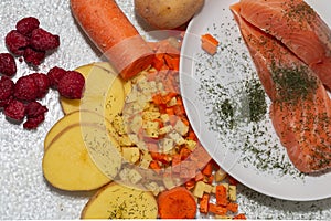 salmon dish with potatoes and carrots